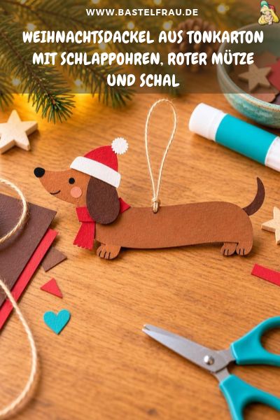 Weihnachtsdackel aus Tonkarton mit Schlappohren, roter Mütze und Schal